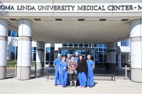 Dr. Parekh, Rickey Rodroguez, and the TARV team standing outside the Loma Linda Medical Center Murrieta