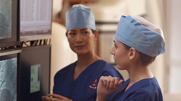 two female physicians reviewing a patient's chart