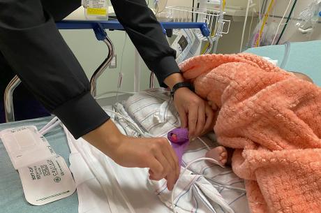 Baby&#039;s foot used to check blood pressure by nurse in hospital