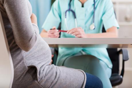 Close-up of a pregnant woman during medical visit