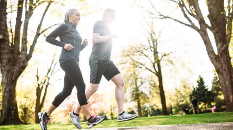 Couple running outdoors