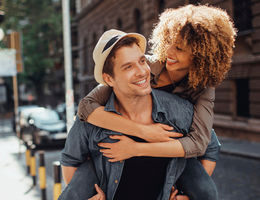 Couple outside walking while embracing