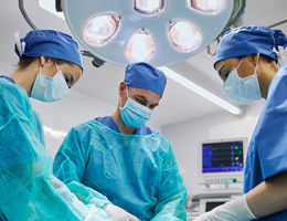 Physicians performing a surgery